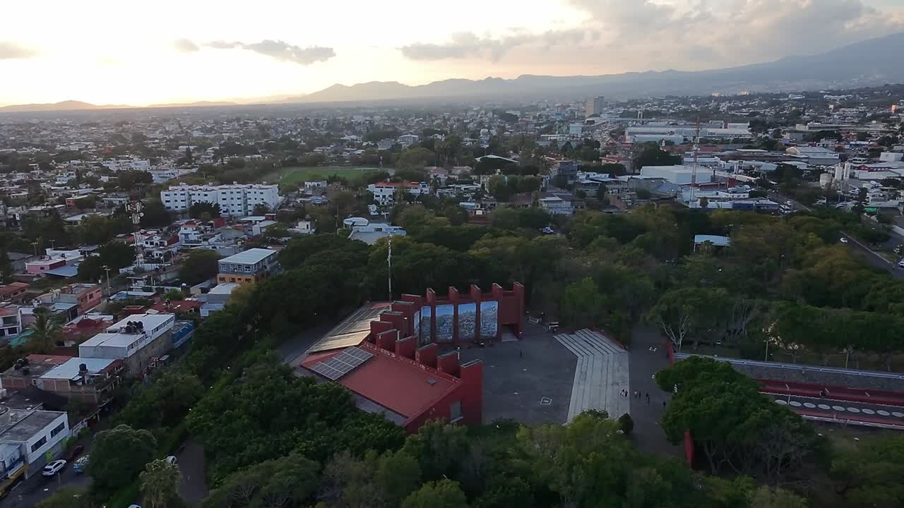 Establishing drone shot of Park Alameda at sunset in Jiutepec, Morelos, Mexico