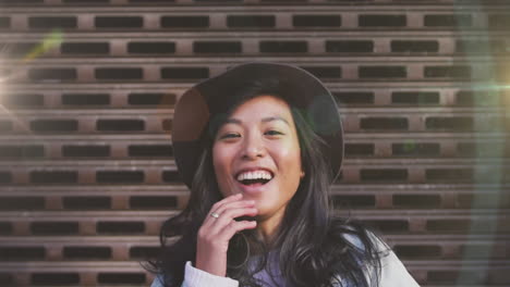 animation of light spots over smiling asian woman