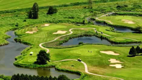 golfers and golf carts at golf course on sunny day in surrey, bc, canada