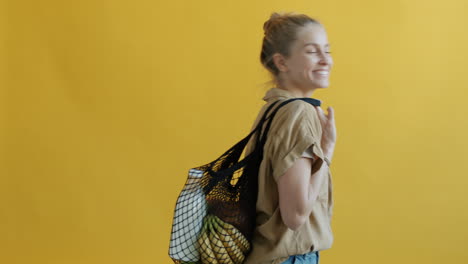 woman with reusable shopping bag
