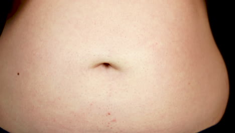 young man eating burger, close up from head to fat belly