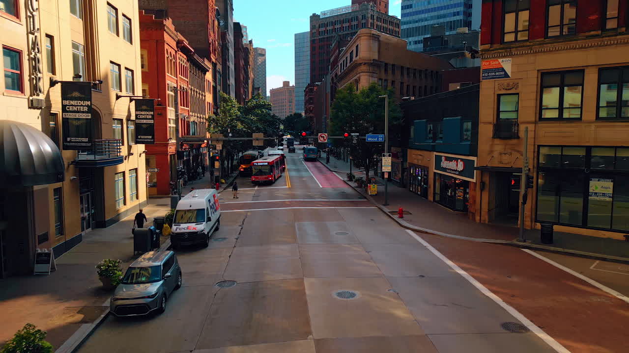 Pittsburgh, USA, 2 August 2025: Moving over the street with beautiful old-style buildings. Approaching road signs over the road. Pittsburg, Pennsylvania, USA