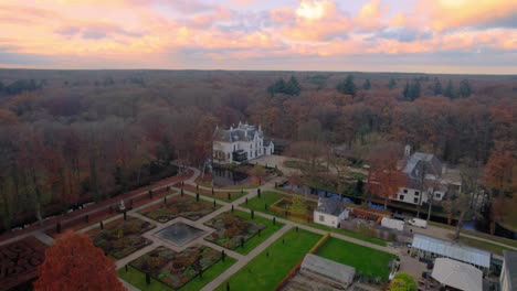 AERIAL---Staverden-Castle-at-sunset-in-the-smallest-city-in-the-world,-Netherlands