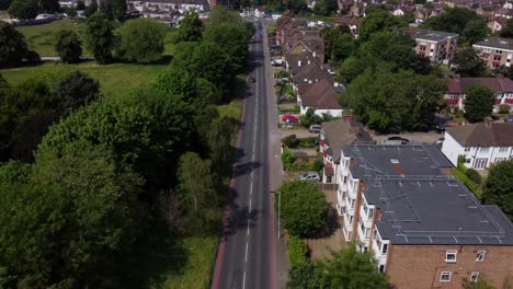 Drone-shot-flying-over-residential-low-rise-houses-on-street-in-England