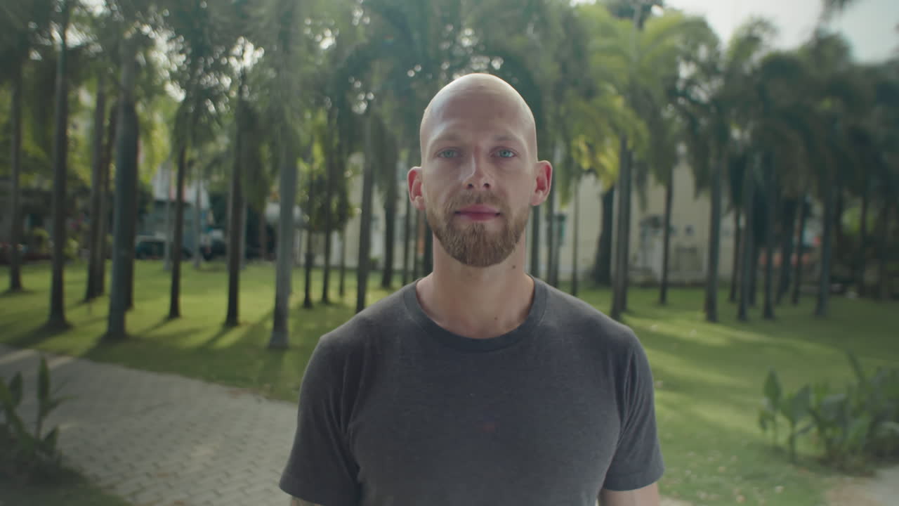 Man Posing on Camera in Park on Summer Day