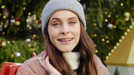 portrait video of woman with chopping bag in winter