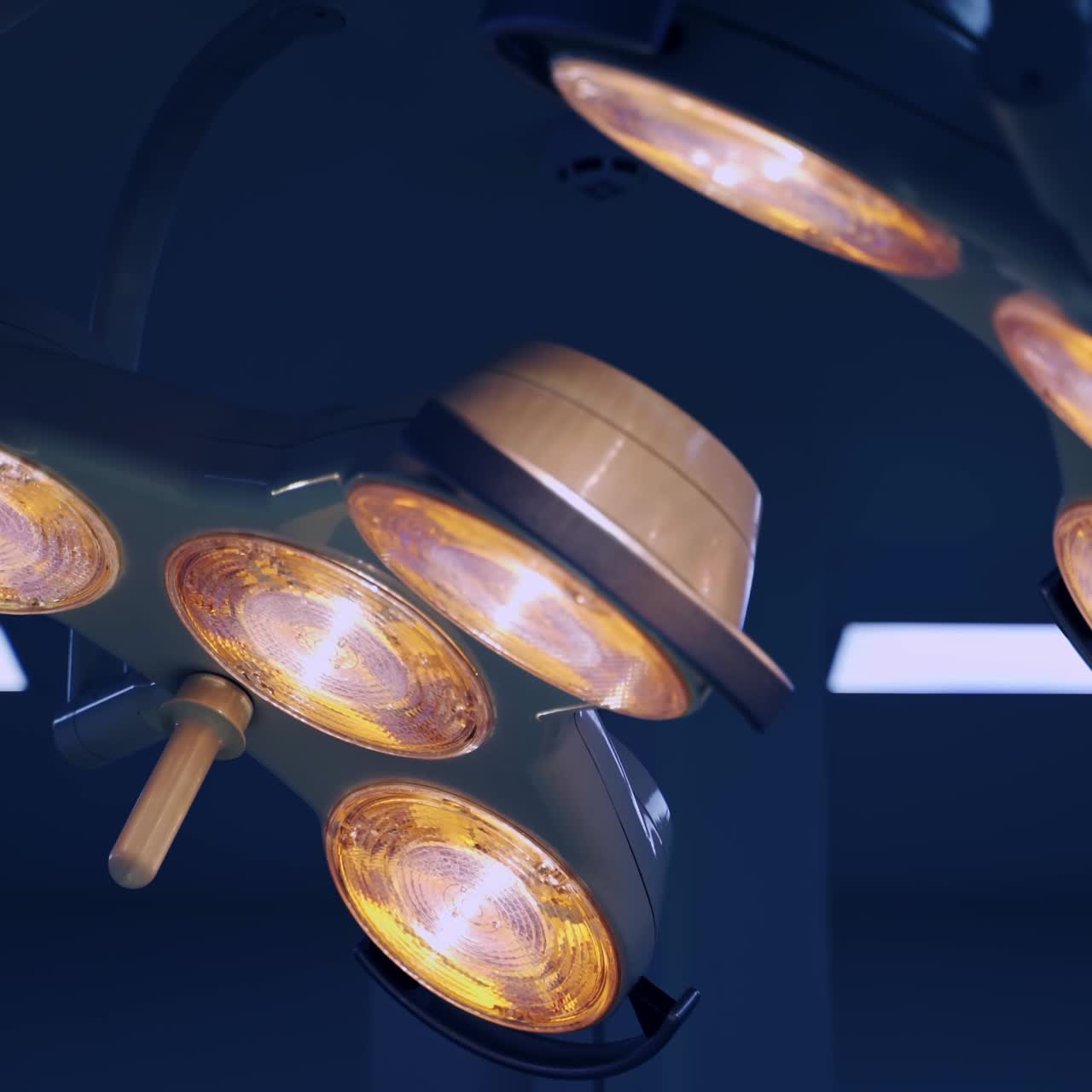 Special lamps switched on for the surgical operation. Drop counter with bottle of medicines hanging on the stand