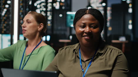 portrait of african american advisor uses laptop in a night meeting