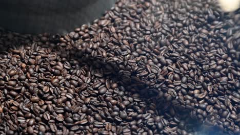 The-coffee-roasting-and-production-of-brown-coffee-beans-are-mixed-and-cooled-after-roasting-in-a-container