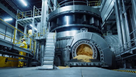 large-scale industrial processing machine with worker in a factory