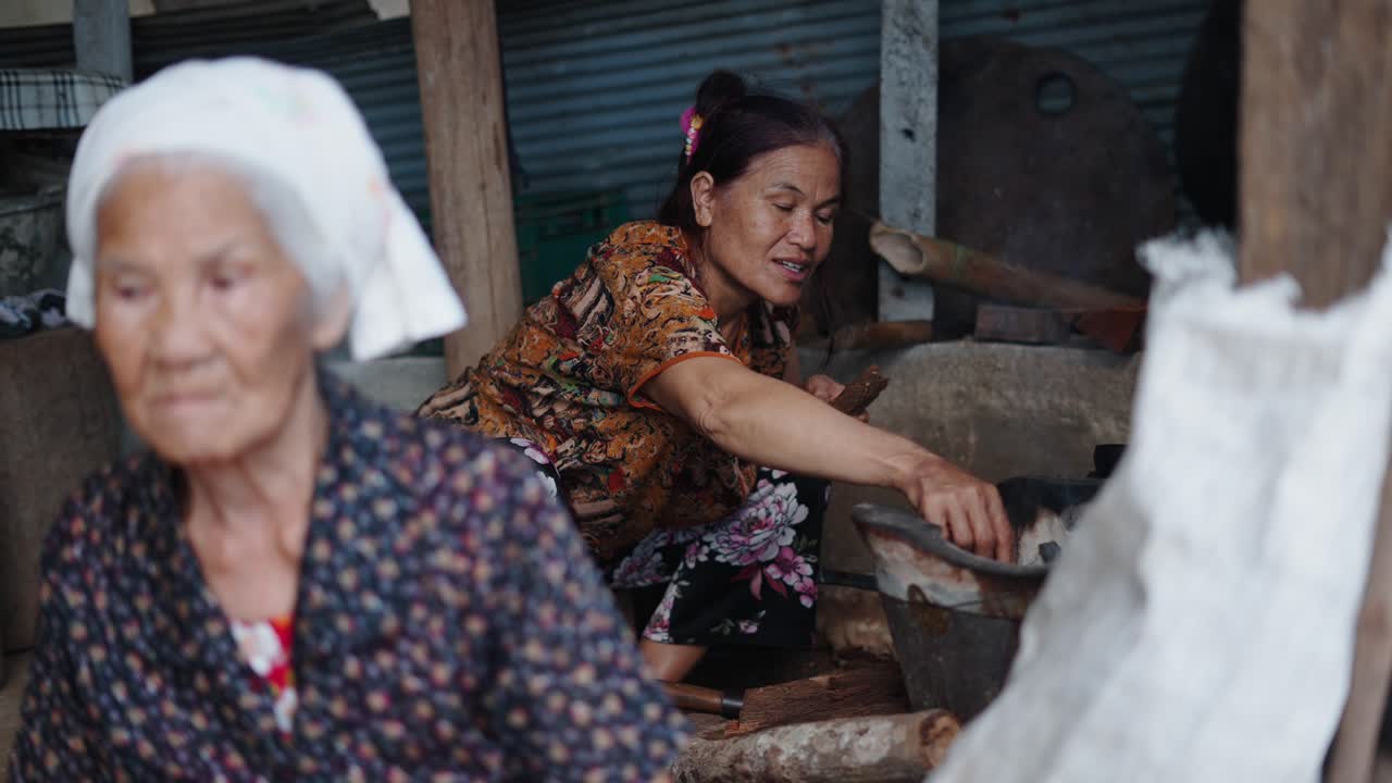 Women Cooking in a Traditional Setting