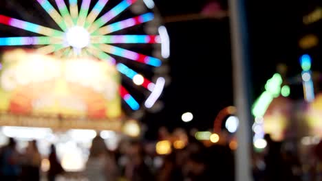 carnival fair grounds at night. defocused footage.