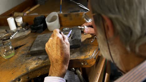 goldsmith manufacturing jewellery in workshop 4k