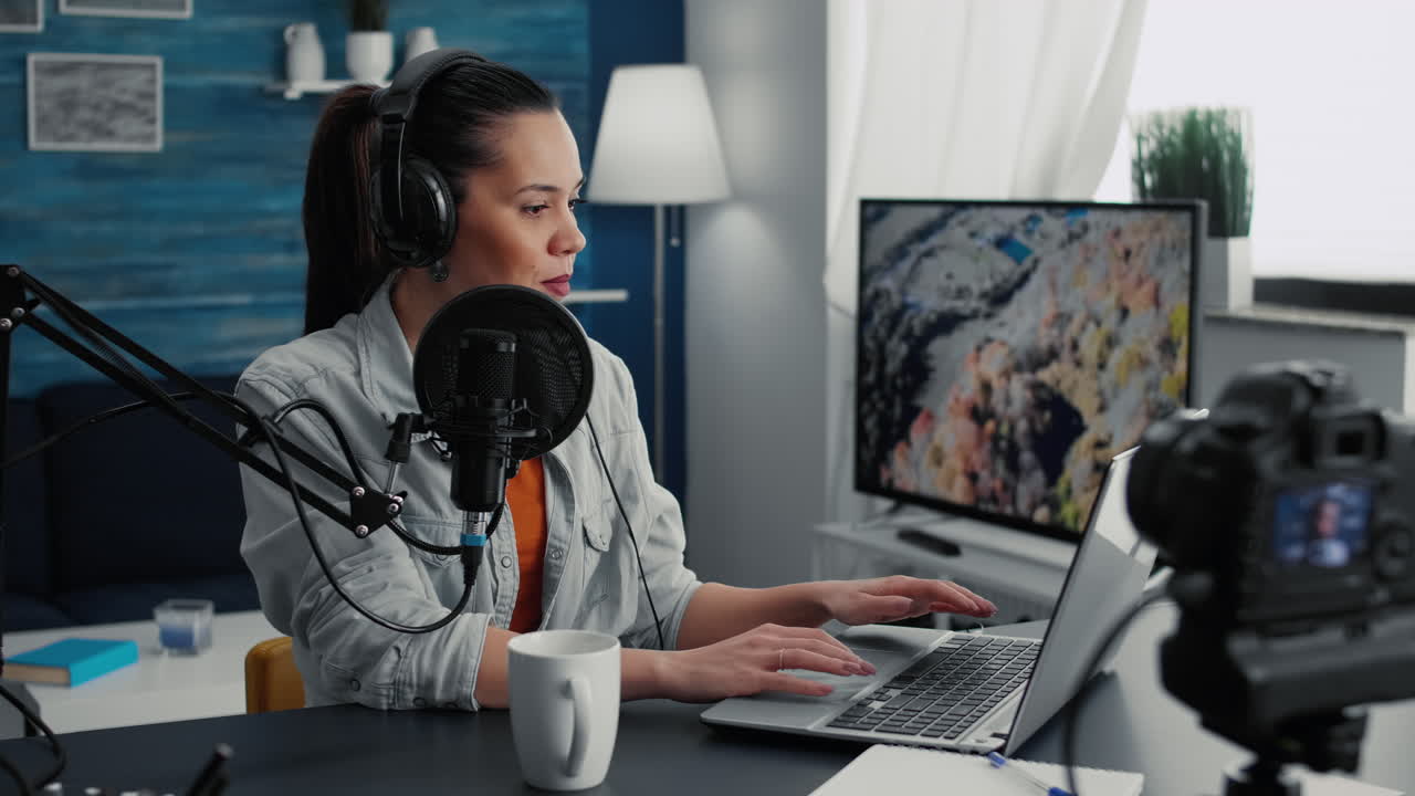 Creative digital content creator answering audience questions while streaming live on internet