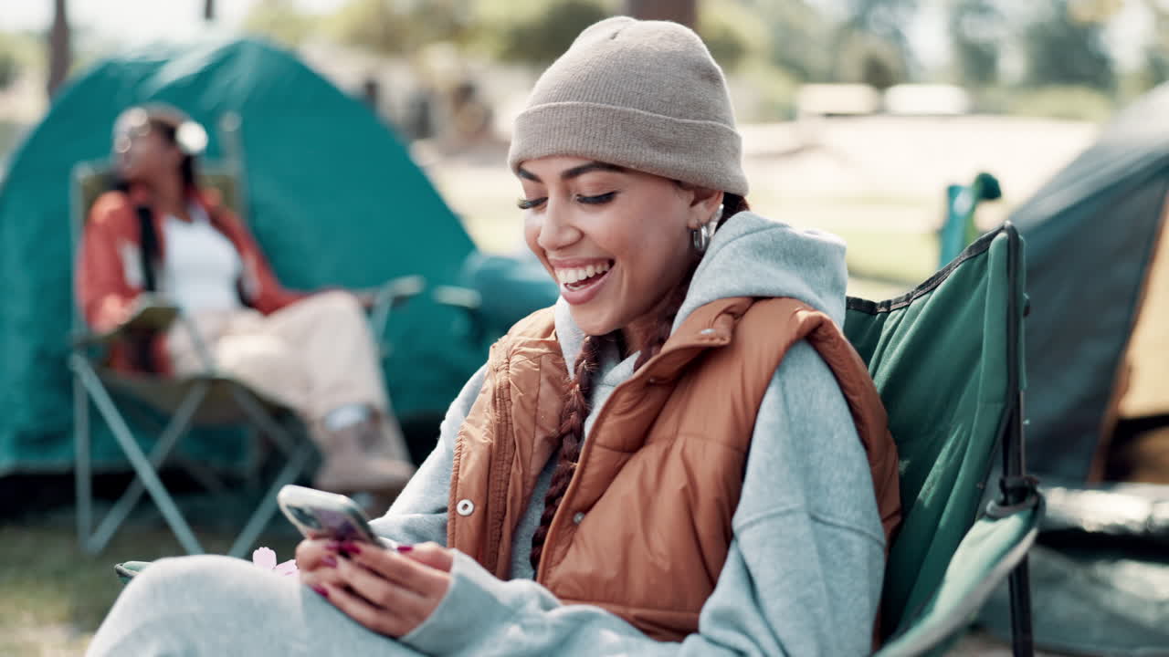 Woman Camping and Using Mobile Phone