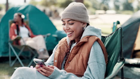 woman camping and using mobile phone