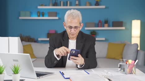 home office worker man having problems and stress on the phone.
