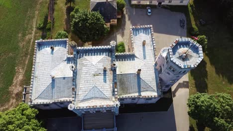 Vecauce-Manor-in-Latvia-Aerial-View-of-the-Pink-Castle-Through-the-Park