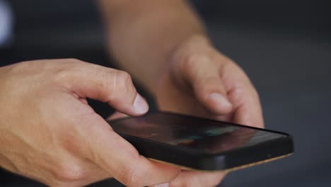 closeup of teenager hands typing on the mobile phone