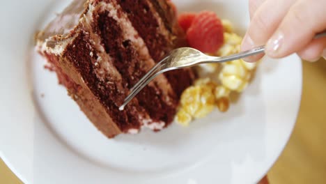 woman having cake in cafe 4k