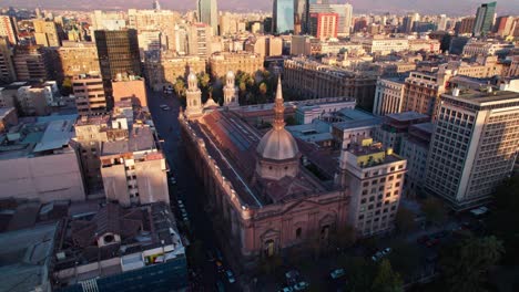 aerial orbit around the metropolitan cathedral of santiago with harsh shadows