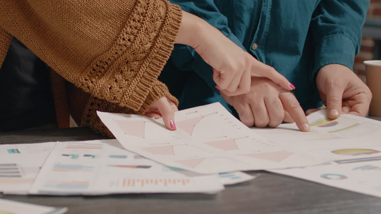 Business Meeting with Charts and Graphs