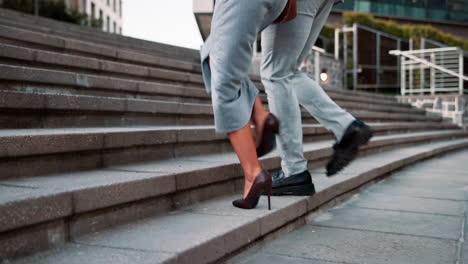 business people walking upstairs in city