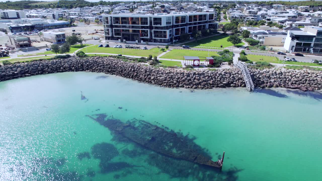 Breathtaking drone footage captures the Omeo shipwreck at Coogee, with a backdrop of coastal development and apartment buildings