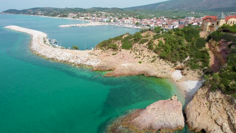 Aerial-View-Over-Metalia-Beach-Passing-A-House-On-A-Majestic-Seaside-Cliff,-Turquoise-Water,-Green-Landscape,-Thassos-Island,-Greece