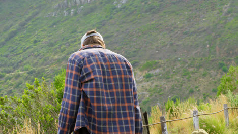 Stylish-young-caucasian-skateboarder-interacting-with-each-other-at-countryside-road-4k