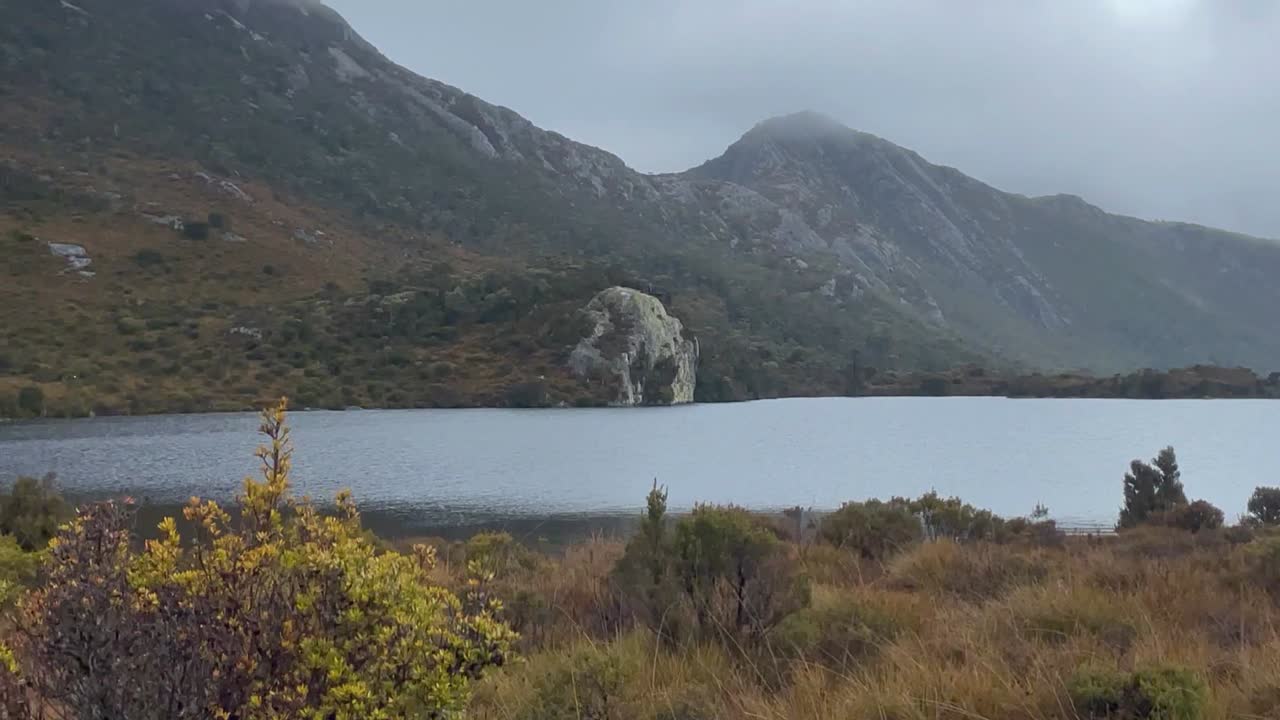 4K sweeping view of a lake and a mountain in Australia on a rainy day