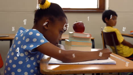 animation of numbers over african american schoolgirl writing in notebook at school