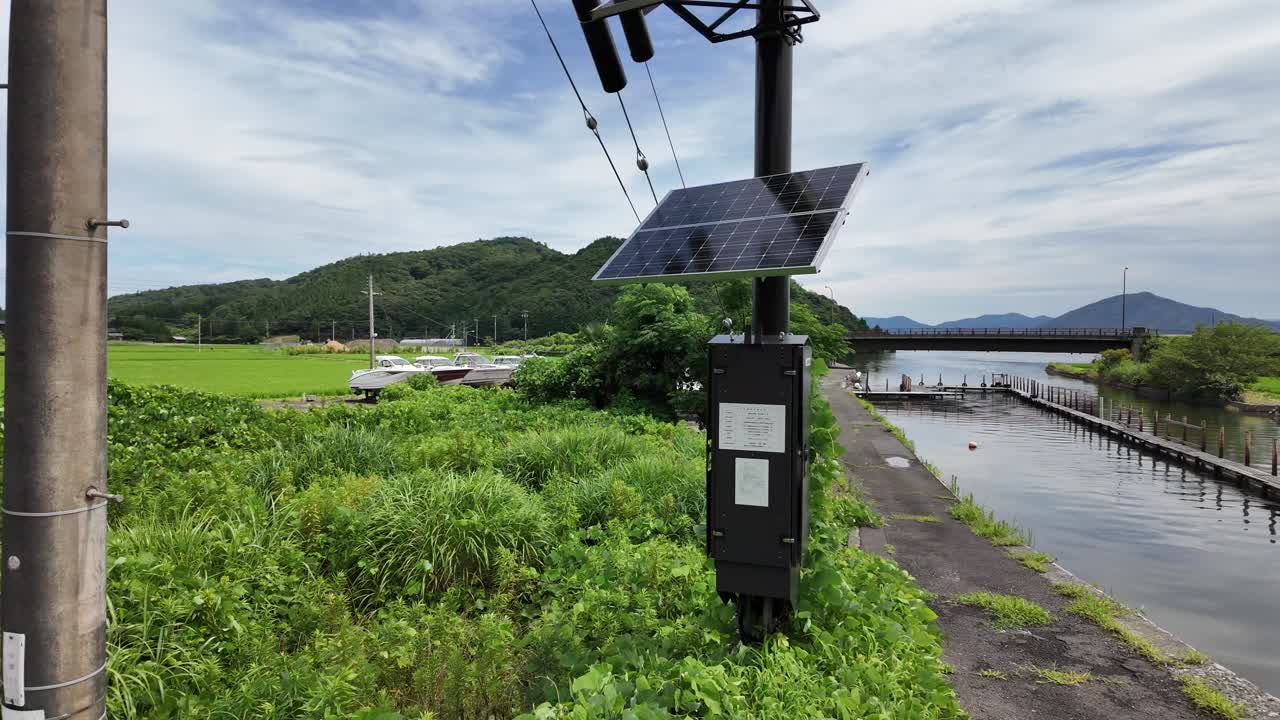 Slow-motion footage of a small solar panel on a pole