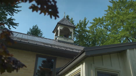 pan to reveal belfry on top of an old schoolhouse building