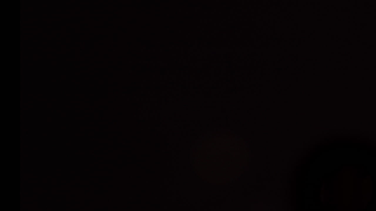 Wide shot of bokeh patterns created by out-of-focus fireworks in the distance