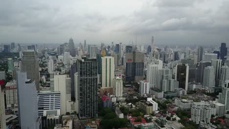 the beautiful and peaceful scenery in bangkok, thailand with glorious trees and unique buildings - aerial shot