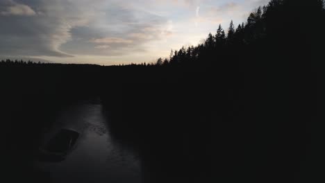 aerial flyover of mountains - river at sunset, landscape