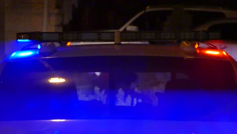 police strobe lights in a mix of red and blue create purple shades