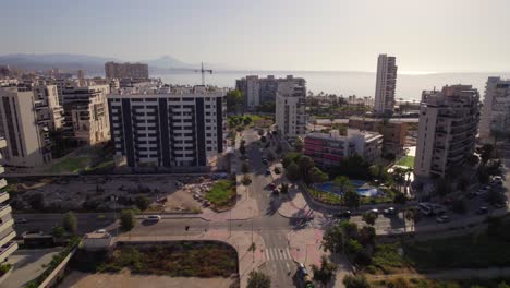 vacation apartment complexes in the coastal city of san juan playa in alicante, spain. aerial view at sunset