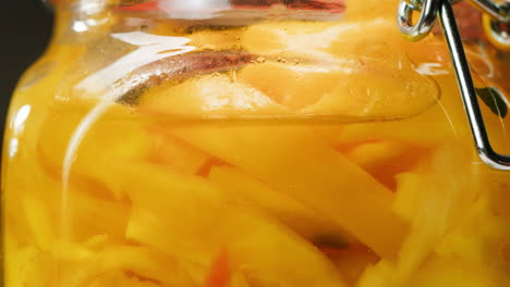 close-up of fermented yellow cabbage in can. preservation of vegetables in glass jars. fermentation preserved vegetables. sauerkraut with spices.