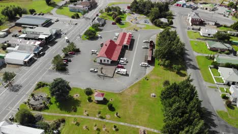 aerial pull back from lumsden information centre, reveal of housing area, new zealand