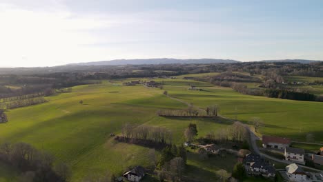 Lush-green-fields-for-farming-animals-during-a-sunset