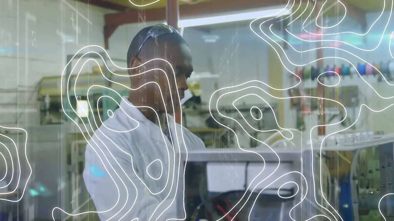 Animation of white lines over african american male scientist working in lab