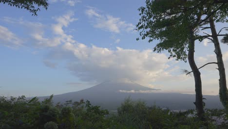 A-captivating-daytime-timelapse-unveils-Fuji-mountain,-crowned-by-a-colossal-cloud