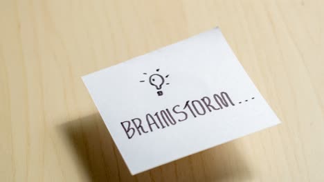 a sticky note captures a brainstorming moment emphasizing creativity in an office setting.