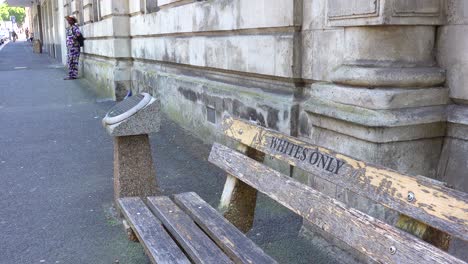 a bench saying whites only on a street in cape town south africa