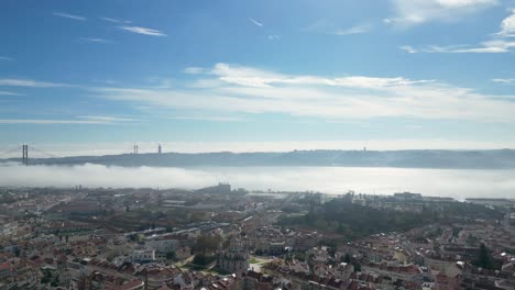 the tagus river in the early morning flowing through the capital city of lisbon, portugal