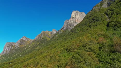 Aerial-of-the-peaks-and-hills-around-Rovde-near-Syvdefjorden-in-the-Vanylven-Municipality,-Norway