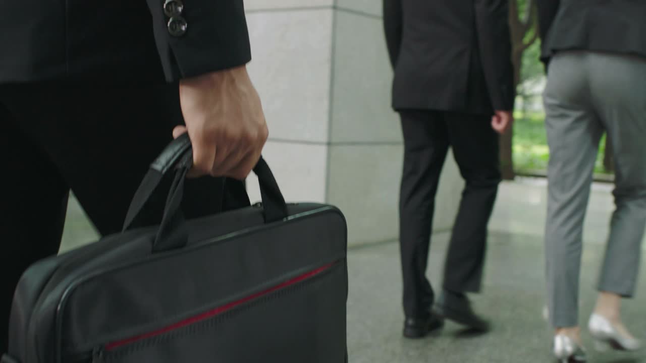business people walking in modern office building