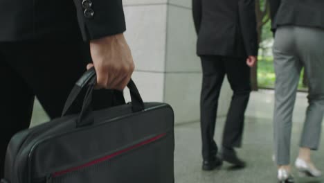 business people walking in modern office building